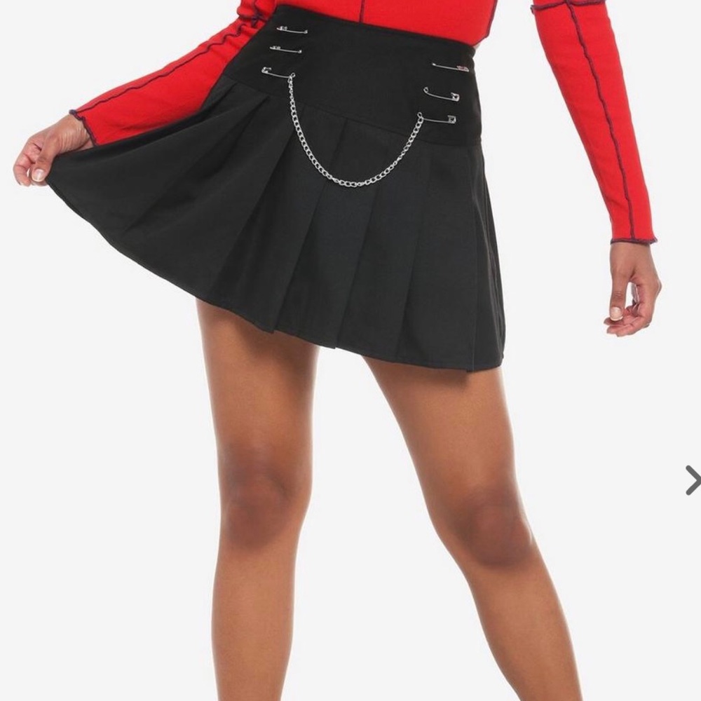 Brand New! Black Skirt with Safety pin and chain embellishments. Size Large